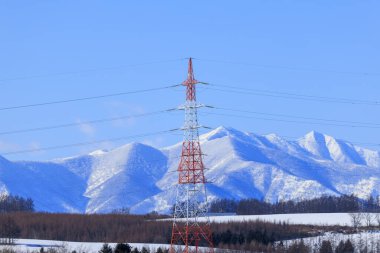 Steel tower and Hidaka Mountains clipart