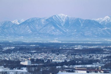 hidaka mountain range and obihiro city clipart