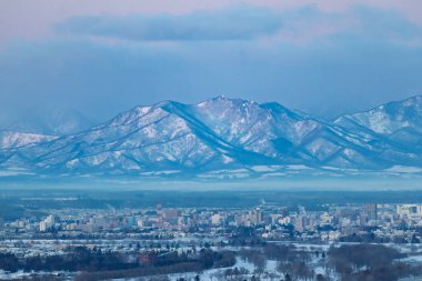 hidaka mountain range and obihiro city clipart