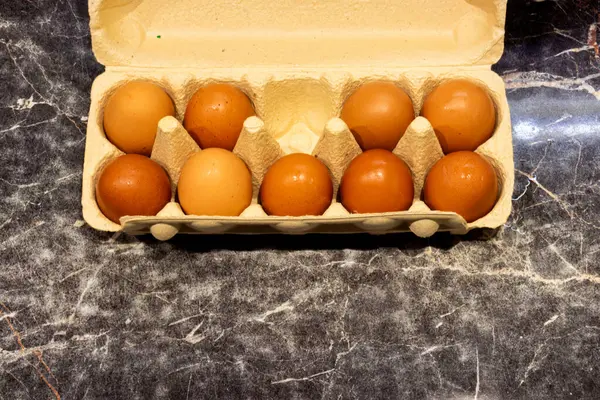 Packing chickenPacking chicken eggs in a tray, one egg missing eggs in a tray, one egg missing. High quality photo