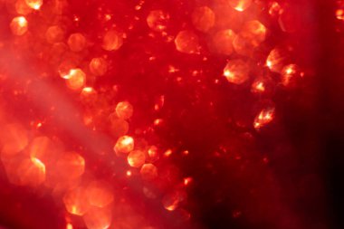 Soyut kırmızı parlak parıltı bulanık Noel ve Yeni Yıl arkaplanı, metin ve tasarım için kopyalama alanı