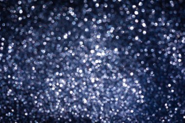 Abstract glitter lights textured dark blue and white background, de-focused, bokeh. Christmas or New Year festive blured sparkling background, winter holidays card concept clipart