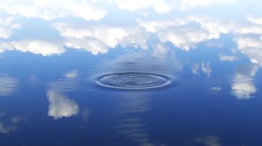 water surface in the form of a small lake, blue water splash, water splash in the sky