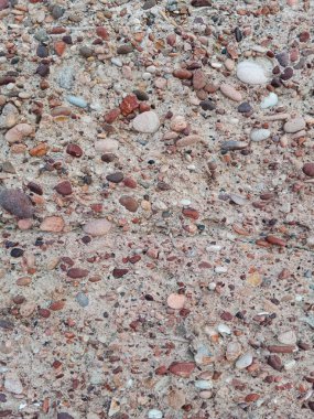 Gri, kahverengi ve beyaz tonlarında doğal taş dokusuna yakın çekim.