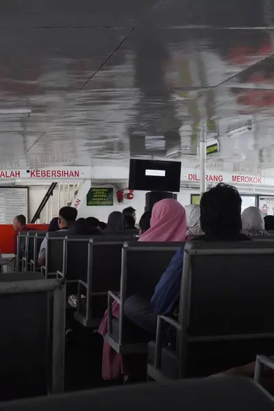 stock image Ferry passengers sitting inside an Indonesian ferry