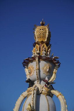 Monument at Benoa harbor Bali clipart