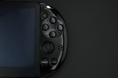 Black playstation vita console dpad buttons with black background clipart