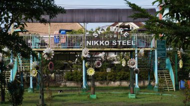 A sky bike ride in the Singha park Malang which is no longer operating and abandoned clipart