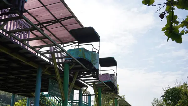 stock image Sky bike rides in Taman Singha Malang which have not been operating for a long time and are stalled. The train and rails also look rusty