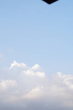 Background of bright blue sky with white clouds clipart