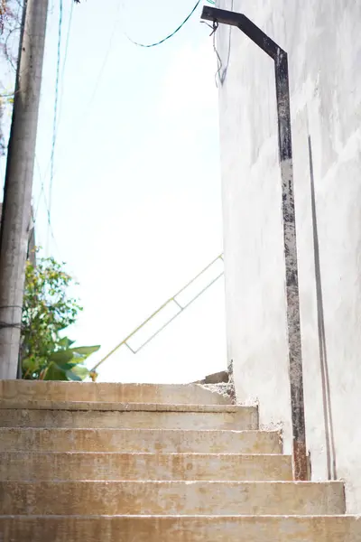 stock image A street with stairs for pedestrians that is quiet during the day