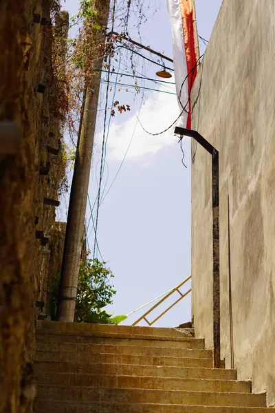 stock image A street with stairs for pedestrians that is quiet during the day