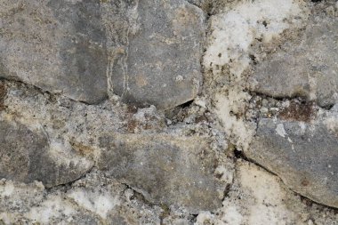 Yığılmış gri kireç taşından yapılmış bir duvardaki soyut arkaplan