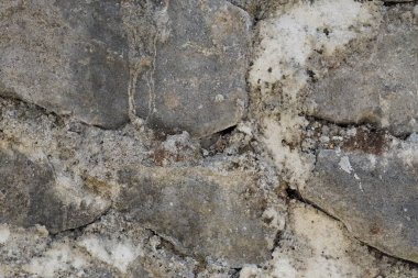 Yığılmış gri kireç taşından yapılmış bir duvardaki soyut arkaplan