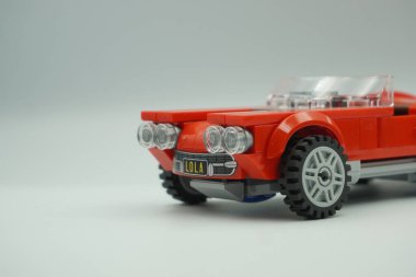 The front of the red vintage car Lego bricks toy without a roof clipart