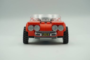 The front of the red vintage car Lego bricks toy without a roof clipart