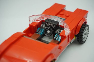 Driver seat part of the red vintage car bricks toy without roof clipart