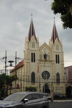 Old church in the middle of Malang city (Kayutangan Heritage) in the afternoon with cloudy clouds clipart