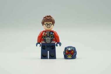 Lego mini figure Justin Hammer bricks toy with red and blue costume on white background clipart