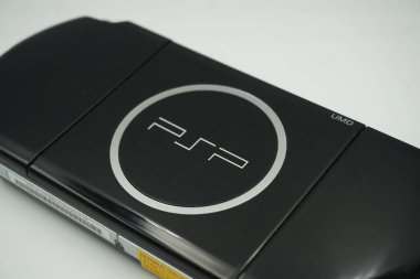 The Playstation Portable (PSP) logo on the back of the unit is black with a white background clipart