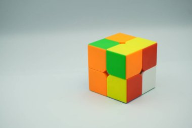 Scrambled 2x2 Rubik's cube with white background clipart