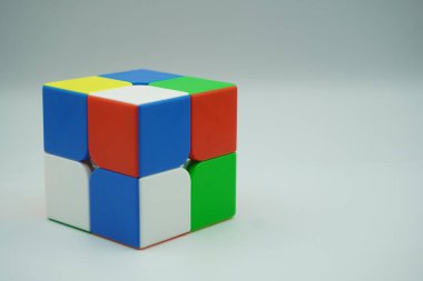 Scrambled 2x2 Rubik's cube with white background clipart