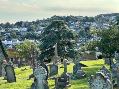 a low angle view of a church in Lyme Regis Dorset  under a blue sky on a sunny day clipart