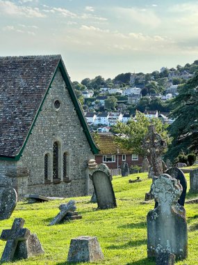 a low angle view of a church in Lyme Regis Dorset  under a blue sky on a sunny day clipart