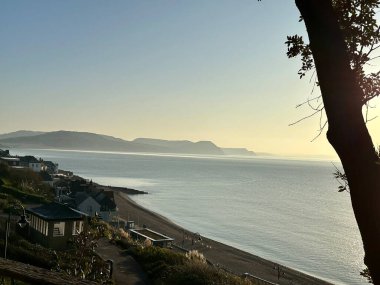 Sunrise over the Jurassic coast Lyme Regis Dorset England  clipart