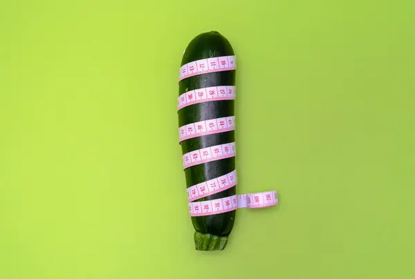 Green Zucchini Measuring Tape Green Background Concept Size Male Penis — Fotografia de Stock