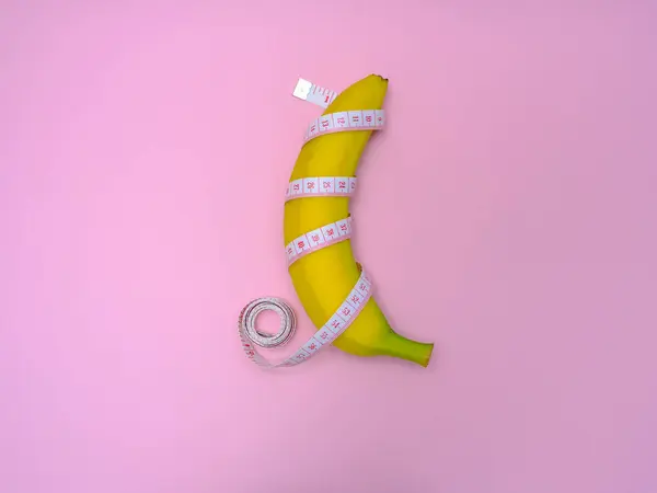 Yellow Banana Measuring Tape Pink Background Concept Size Male Penis — Foto de Stock
