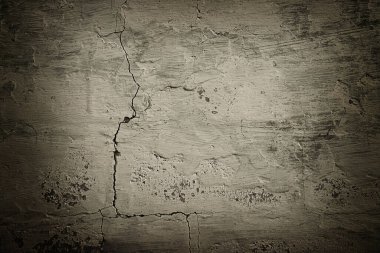 Eski çatlamış çimento duvarının arkaplanında vignet var.