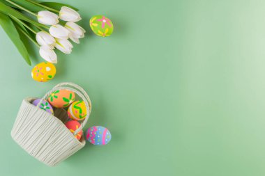 Easter eggs many color in basket with flower for easter background