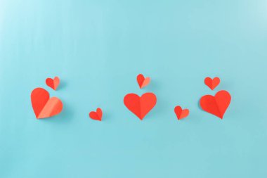 Valentines day with red heart paper and small heart on background