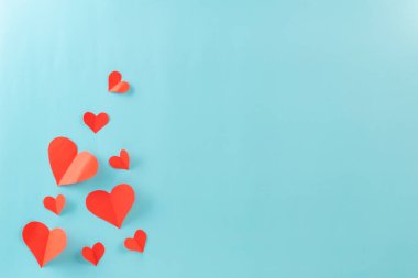 Valentines day with red heart paper and small heart on background