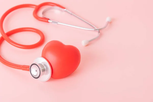 Red heart with doctor physician's stethoscope, World heart health day, doctor day.