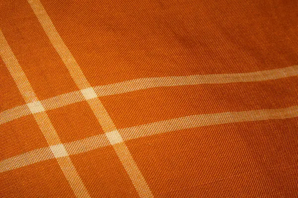 A beautiful sharp orange color Kain Pelikat or Kain Sarong with stripe forming a square shape. A traditional fabrics from Malaysia.
