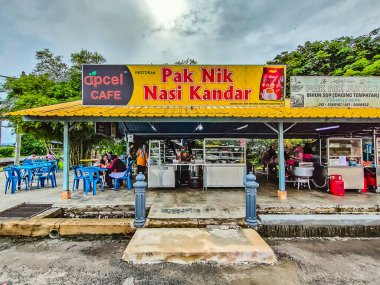 Kedah, Malaysia. People eating at Restaurant, known as 