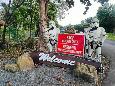 Perlis, Malaysia - January 21, 2024: A welcome sign with storm troopers from star wars as probe at the entrance of Tasoh Lake Resort by Tasoh TasikKu at tasik timah tasoh, perlis, malaysia. clipart
