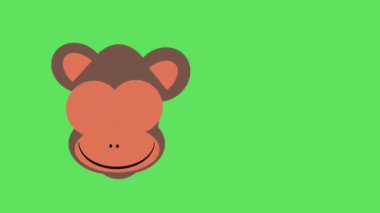 yeşil arka planda göz kırpan maymun suratı