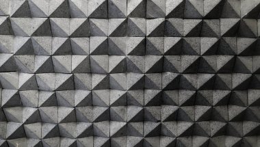 Elmas desenli gri arka plan. Siyah ve beyaz elmas üçgen şekilli gölgeli beton duvar.