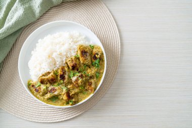 Afghani chicken in green curry or Hariyali tikka chicken hara masala with rice - Asian food style
