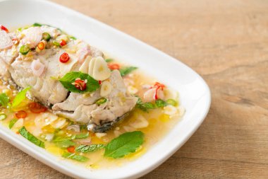 steamed sea bass fish fillet steak with herbs