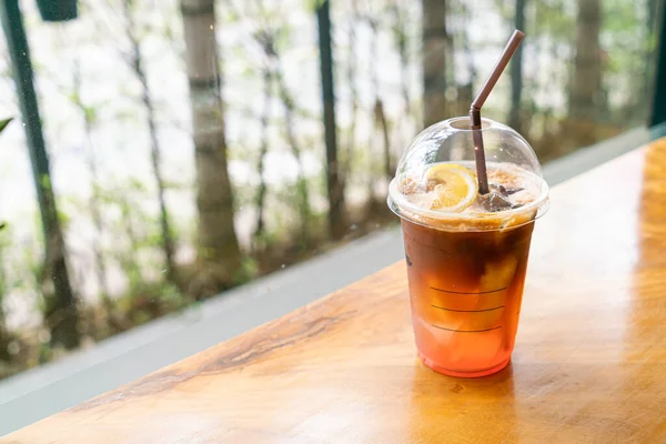 espresso coffee shot with lemon peach soda glass in coffee shop cafe