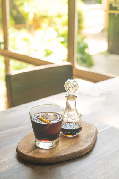 iced cold brew coffee on wood tray - soft focus point