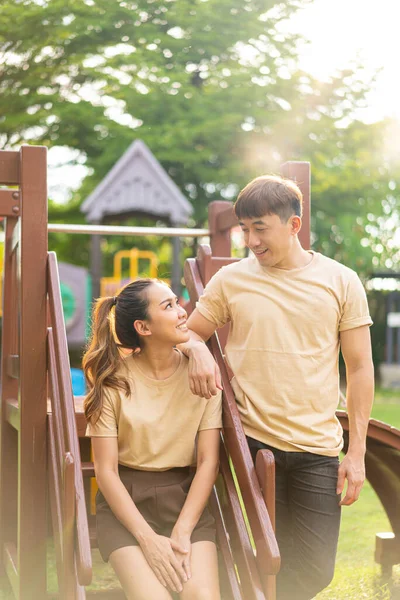 Asian Couple Love Play Seesaw Smiling Kids Playground — Stockfoto