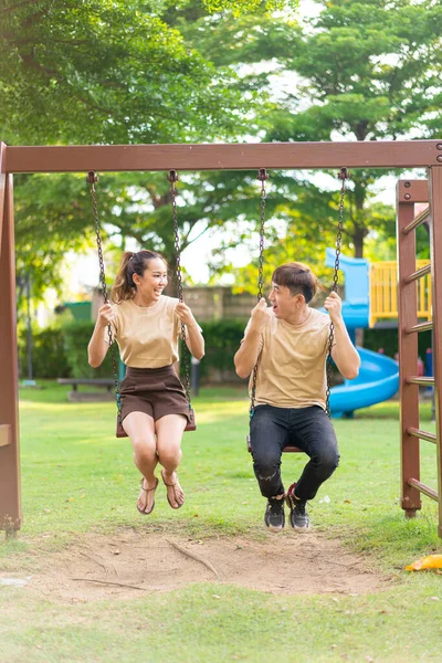 Asian Couple Love Play Swing Kids Playground — Stockfoto