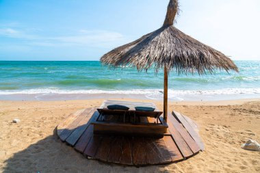 beach chair and umbrella with sea beach background - Holidays and vacation concept