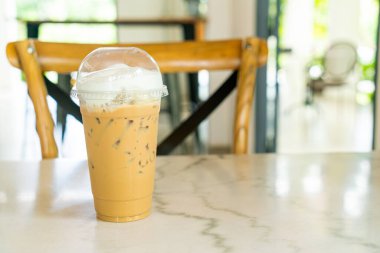 iced cappuccino coffee glass on table in coffee shop cafe
