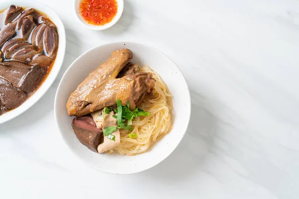 stock image dried noodles with braised duck in white bowl - Asian food style